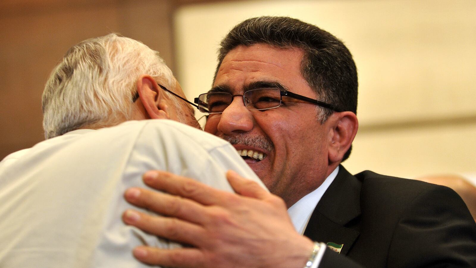 articles/2013/03/23/the-texan-leader-of-the-syrian-rebels/130322-dettmer-syrian-hitto-tease-embed1_g9dma6