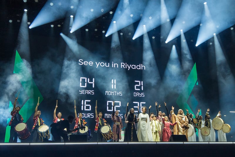 OSAKA, JAPAN - OCTOBER 10: Performers thank attendees as a real time digital countdown of the upcoming World Expo 2030 Riyadh, is displayed at the World Expo 2025 Osaka - "From Osaka to Riyadh" at Osaka Expo Arena Matsuri on October 10, 2025 in Osaka, Japan. (Photo by Wei Ming Ng/Getty Images)