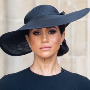 LONDON, ENGLAND - SEPTEMBER 19: (L-R) Meghan, Duchess of Sussexduring the State Funeral of Queen Elizabeth II at Westminster Abbey on September 19, 2022 in London, England. Elizabeth Alexandra Mary Windsor was born in Bruton Street, Mayfair, London on 21 April 1926. She married Prince Philip in 1947 and ascended the throne of the United Kingdom and Commonwealth on 6 February 1952 after the death of her Father, King George VI. Queen Elizabeth II died at Balmoral Castle in Scotland on September 8, 2022, and is succeeded by her eldest son, King Charles III. (Photo by Samir Hussein/WireImage)