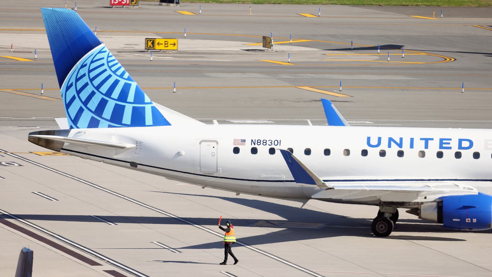A United Airlines jet moves along the runway at LaGuardia AIrport on November 10, 2022 in the Queens borough of New York City.