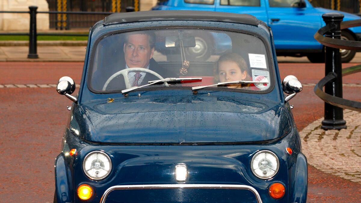 articles/2013/12/18/david-linley-roars-up-to-queen-s-party-in-miniscule-fiat-500/linley_hfkdp3