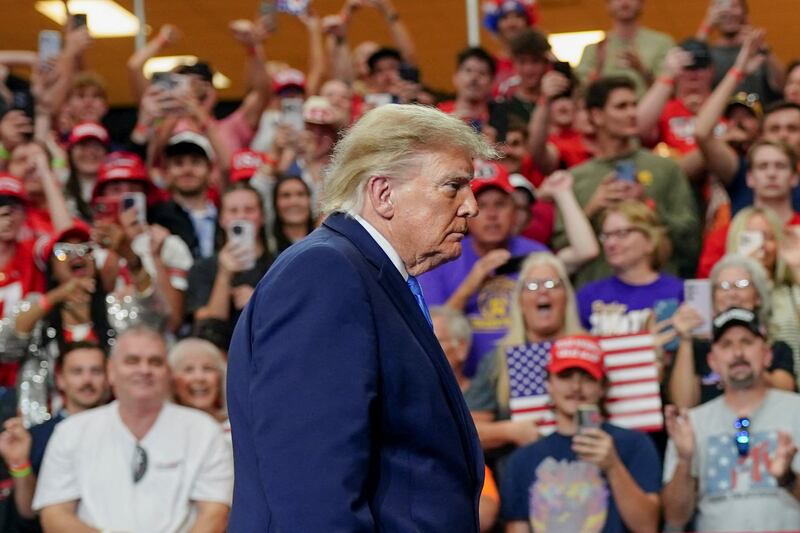 Supporters in the audience cheer as US President Donald Trump walks after his address at a rally at Butler High School in Vandalia, Ohio, US, October 3, 2026. REUTERS/Nathan Howard