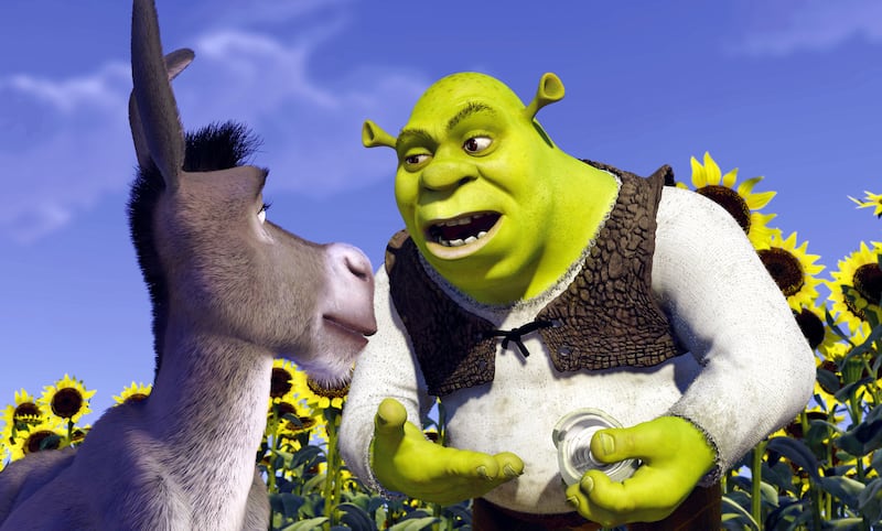 Shrek (R), with the voice of actor [Mike Myers], and the Donkey (L), with the voice of actor [Eddie Murphy], from a scene in the animated film "Shrek", which is presented at the 54th International Cannes Film Festival, May 12, 2001. "Shrek", by [directors Andrew Adamson and Vicky Jenson], is the first animated film entry to compete for the Palme d'Or since 1953. "Shrek" opens at the box office May 18 in the United States. 
(Credit : REUTERS/DreamWorks Pictures - MANDATORY CREDIT )