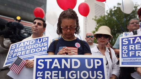 articles/2012/08/15/religious-freedom/religious-freedom-protestor_n99a9i
