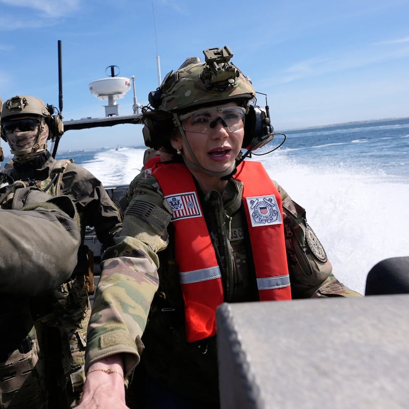 US Secretary of Homeland Security Kristi Noem (R) pilots a US Coast Guard Response Boat-Small (RBS) with the Maritime Security Response Team in San Diego, California, on March 16, 2025.