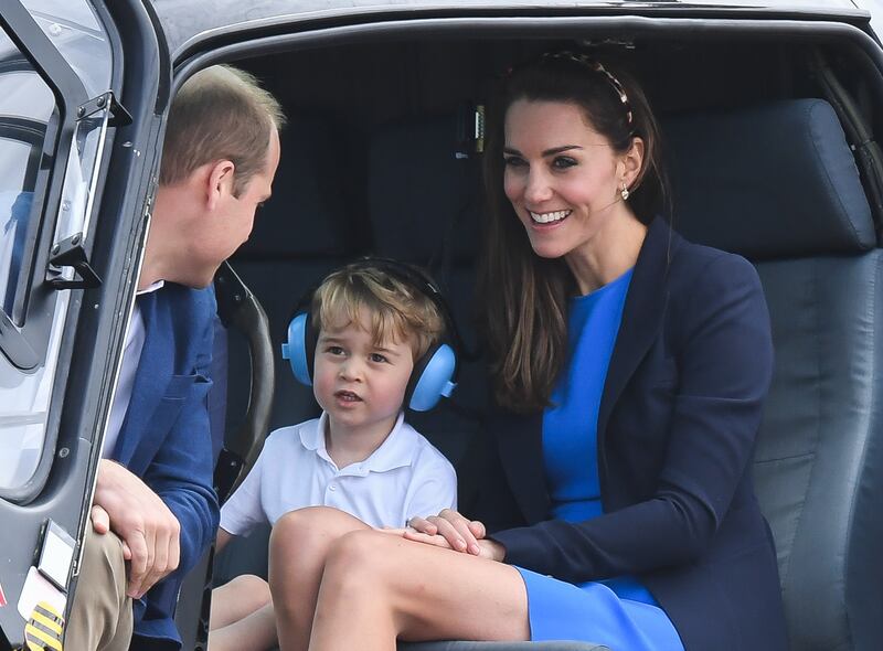 Prince George in a helicopter with his parents.