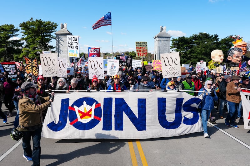 Demonstrators walk across the Memorial Bridge from Arlington, Virginia into Washington, DC, during the "No Kings" national day of protest on March 28, 2026. Nationwide protests against US President Donald Trump are expected Saturday as millions of people vent fury over what they see as his authoritarian bent and other forms of cruel, law-trampling governance. It is the third time in less than a year that Americans will take to the streets as part of a grassroots movement called "No Kings," the most vocal and visual conduit for opposition to Trump since he began his second term in January 2025. (Photo by Aaron Schwartz / AFP via Getty Images)
