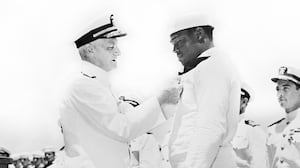 Admiral Chester W. Nimitz pinning Navy Cross on Doris "Dorie" Miller at ceremony aboard the USS Enterprise, Pearl Harbor, Hawaii, U.S. Office of War Information, May 27, 1942.