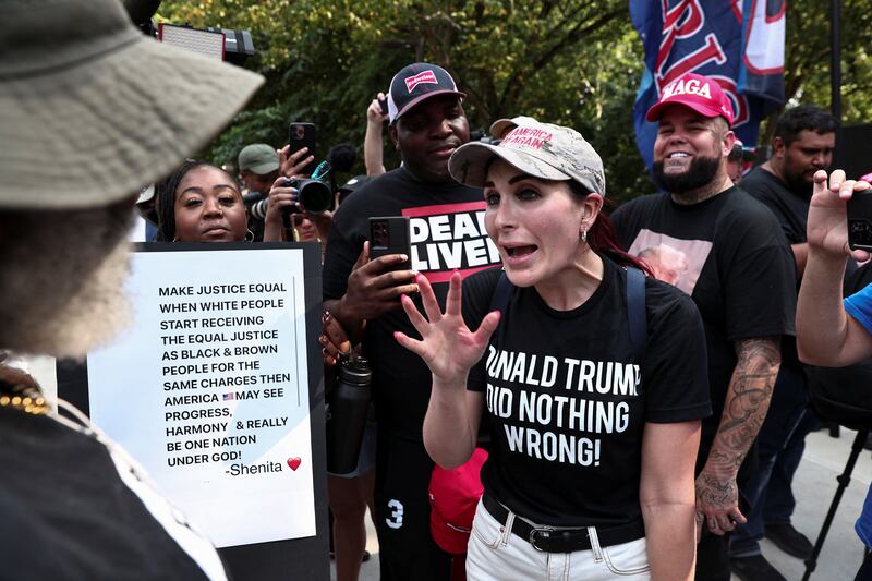 Laura Loomer argues with anti-Trump demonstrators in Atlanta, Georgia, on August 24, 2023.