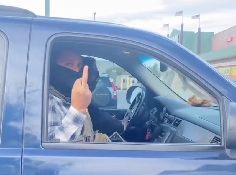 An ICE agent flips Ricardo Mendez the bird for filming the raid.