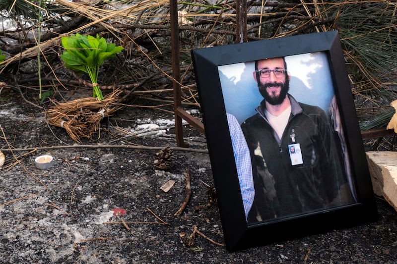 A photograph of 37-year-old Alex Pretti can be seen at a makeshift memorial in the area where he was shot dead by federal immigration agents earlier in the day in Minneapolis, Minnesota, on January 24, 2026.