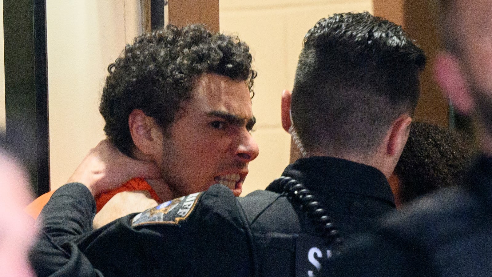 HOLLIDAYSBURG, PENNSYLVANIA - DECEMBER 10: Suspected shooter Luigi Mangione is led into the Blair County Courthouse for an extradition hearing December 10, 2024 in Hollidaysburg, Pennsylvania. Mangione has been arraigned on weapons and false identification charges related to the fatal shooting of United Healthcare CEO Brian Thompson in New York City. Mangione is incarcerated in the State Correctional Institution in Huntingdon, Pennsylvania awaiting extradition to New York. (Photo by Jeff Swensen/Getty Images)