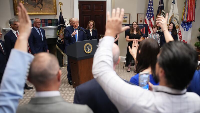WASHINGTON, DC - SEPTEMBER 22: U.S. President Donald Trump (C) answers questions after making an announcement on “significant medical and scientific findings for America’s children” in the Roosevelt Room of the White House on September 22, 2025 in Washington, DC. Federal health officials suggested a link between the use of acetaminophen during pregnancy as a risk for autism, although many health agencies have noted inconclusive results in the research.