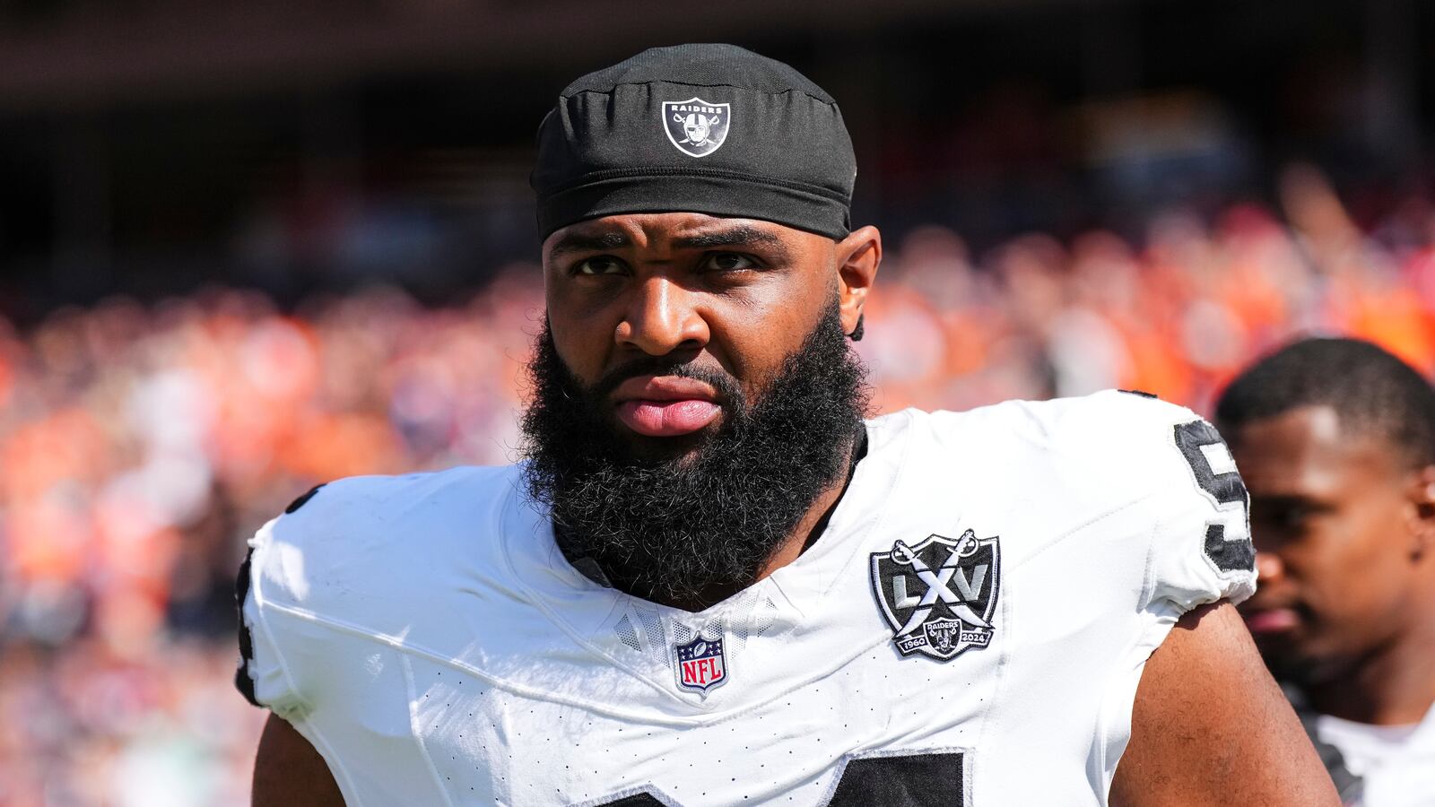 Christian Wilkins #94 of the Las Vegas Raiders looks on from the sideline prior to an NFL football game against the Denver Broncos at Empower Field at Mile High on October 6, 2024 in Denver, Colorado.