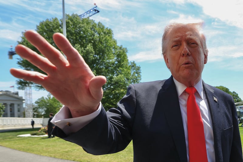 U.S. President Donald Trump speaks to reporters as he departs the White House in Washington, D.C., U.S., May 1, 2026. REUTERS/Kevin Lamarque