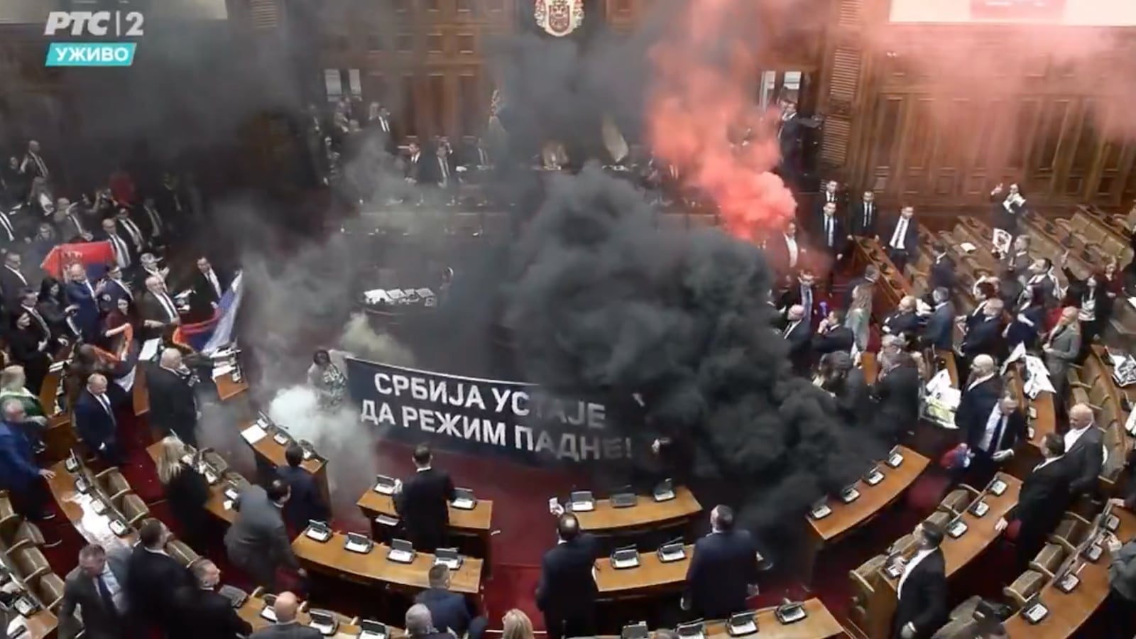 Serbian lawmakers set off smoke grenades in the country's parliament on March 4, 2025.