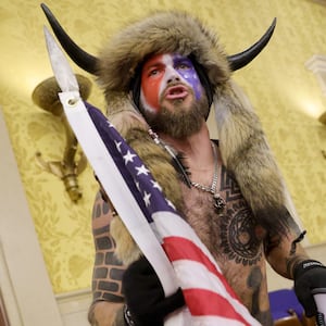 A protester yells inside the Senate Chamber on January 6, 2021 in Washington, DC. Congress held a joint session today to ratify President-elect Joe Biden's 306-232 Electoral College win over President Donald Trump. Pro-Trump protesters entered the U.S. Capitol building during mass demonstrations in the nation's capital.