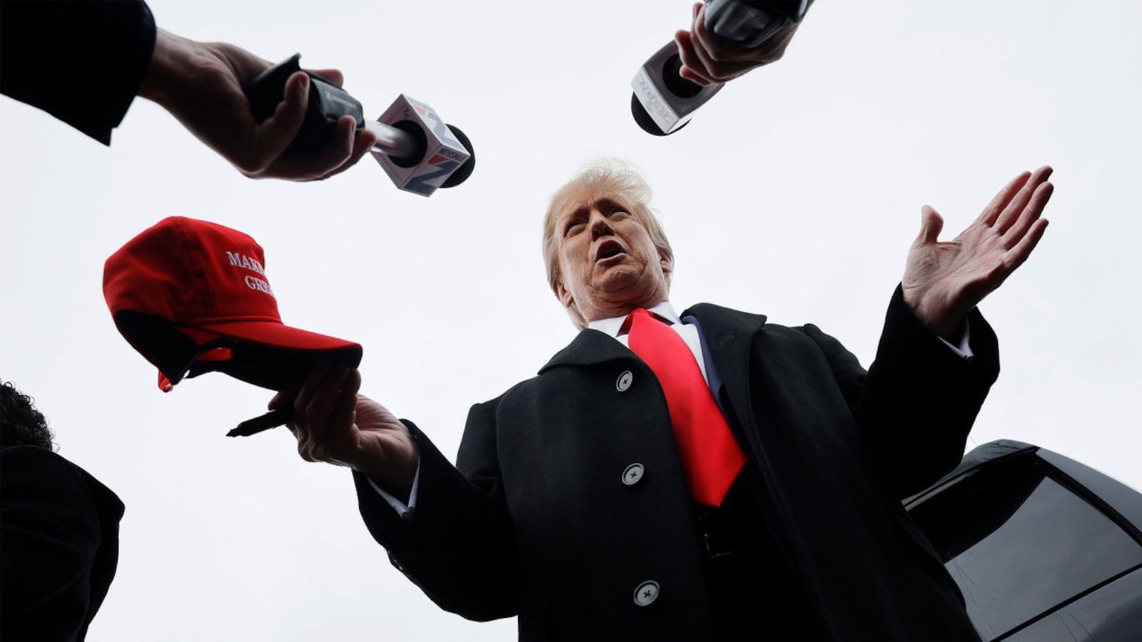 A photo of Donald Trump taking questions from journalists