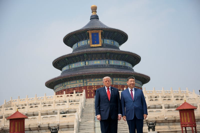 U.S. President Donald Trump and Chinese President Xi Jinping stand together as they tour the Temple of Heaven in Beijing, China, May 14, 2026.