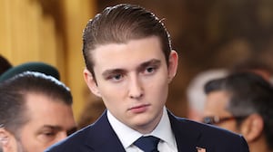 Barron Trump looks on as U.S. Democratic Leader Chuck Schumer waves to a guest during inauguration ceremonies in the U.S. Capitol Rotunda on January 20, 2025 in Washington, DC. Donald Trump takes office for his second term as the 47th president of the United States.