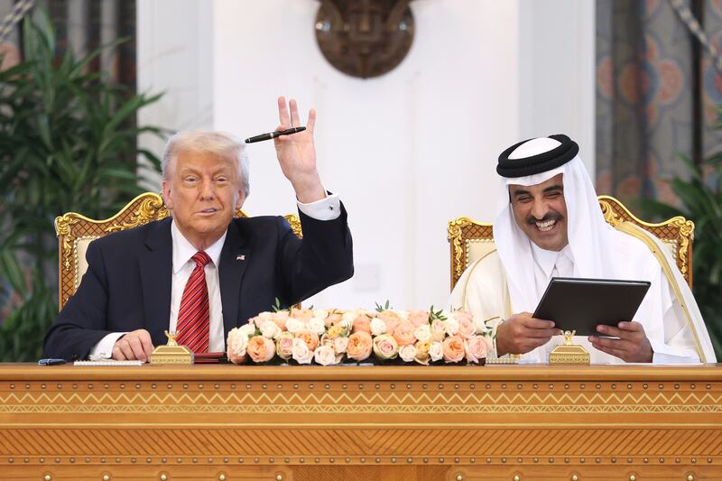 President Donald Trump and Emir of Qatar Tamim bin Hamad al Thani attend a signing ceremony at the Amiri Diwan, the official workplace of the emir, on May 14, 2025, in Doha.