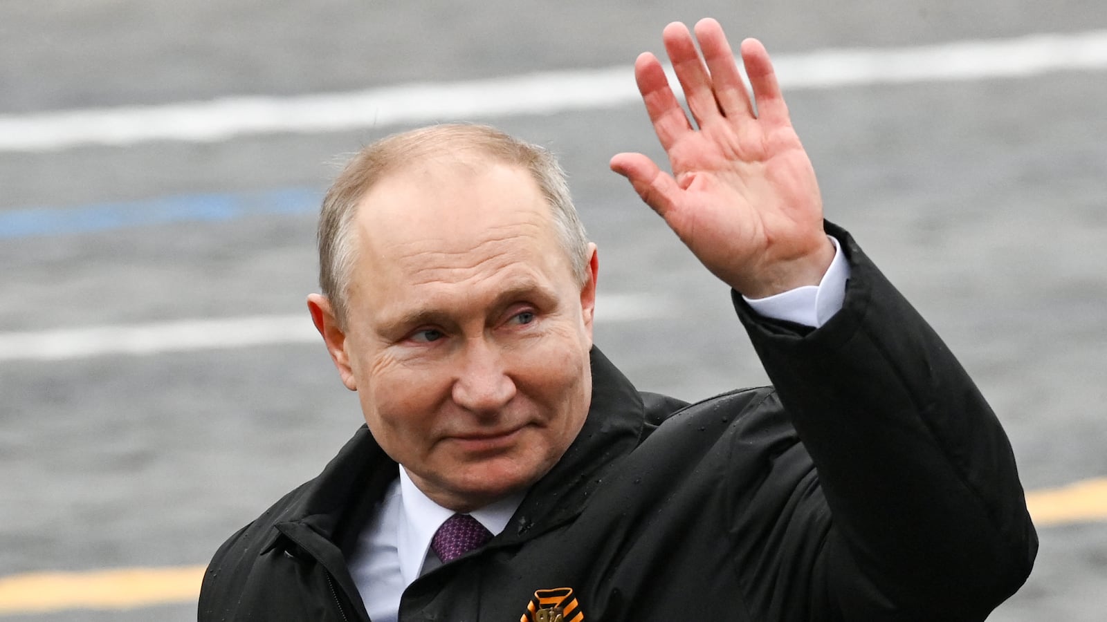 Russian President Vladimir Putin waves.