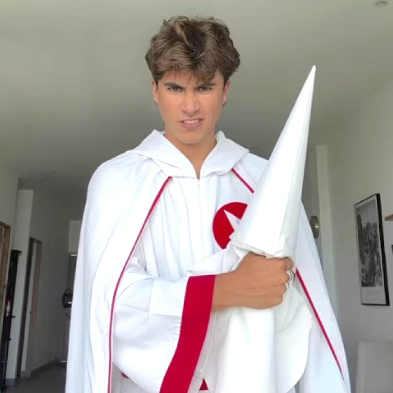 Preston Parra in KKK robes and Mike Collins.