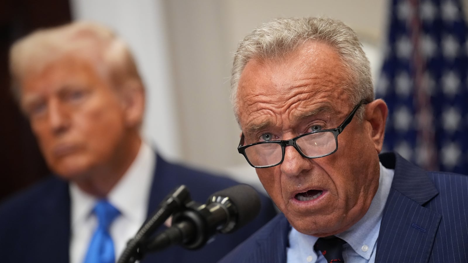 WASHINGTON, DC - SEPTEMBER 22: U.S. Health and Human Services Secretary Robert F. Kennedy Jr., joined by President Donald Trump (L), delivers an announcement on “significant medical and scientific findings for America’s children” in the Roosevelt Room of the White House on September 22, 2025 in Washington, DC. Federal health officials suggested a link between the use of acetaminophen during pregnancy as a risk for autism, although many health agencies have noted inconclusive results in the research.