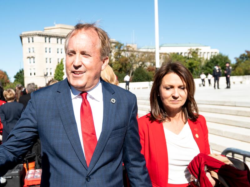 UNITED STATES - NOVEMBER 1: Texas Attorney General Ken Paxton and his wife Angela leave after speaking to pro-life activists outside the Supreme Court after the court heard two challenges to Texass new abortion law on Monday, Nov. 1, 2021. (Photo by Bill Clark/CQ-Roll Call, Inc via Getty Images)