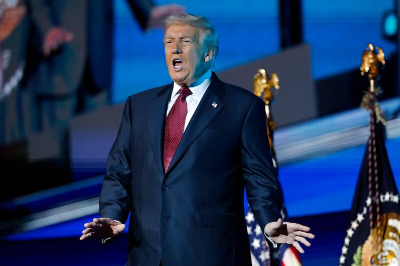 President Donald Trump arrives on stage to deliver remarks during the America Business Forum at the Kaseya Center on November 05, 2025 in Miami, Florida.
