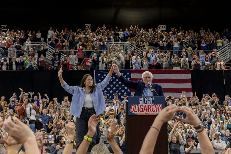 NAMPA, IDAHO - APRIL 14: U.S. Rep. Alexandria Ocasio-Cortez (D-NY) and U.S. Sen. Bernie Sanders (I-VT) speak to a full auditorium as part of the "Fighting Oligarchy" tour on April 14, 2025 in Nampa, Idaho. According to event organizers, 12,500 people attended the rally. (Photo by Natalie Behring/Getty Images)