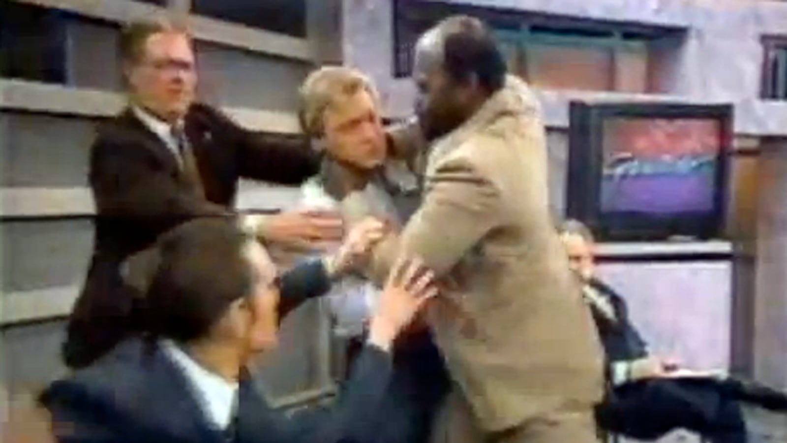 articles/2012/07/15/10-live-tv-brawls-video/tv-fights-tease_sclldv