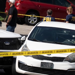 BIDDEFORD, ME - JULY 13: A Kia sedan reportedly driven by the victim of a fatal shooting can be seen with four bullet holes in the windshield at the scene on Pool Street in Biddeford on Monday, July 13, 2026. (Gregory Rec/Portland Press Herald via Getty Images)