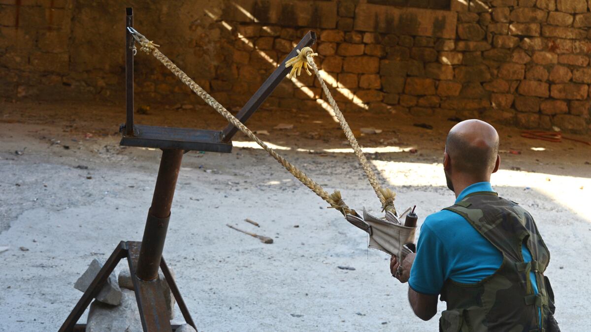 articles/2012/10/23/inside-the-free-syrian-army-s-candy-factories-the-secret-rebel-arms-workshops/day-syrian-arms-tease-embed3_guxmcu