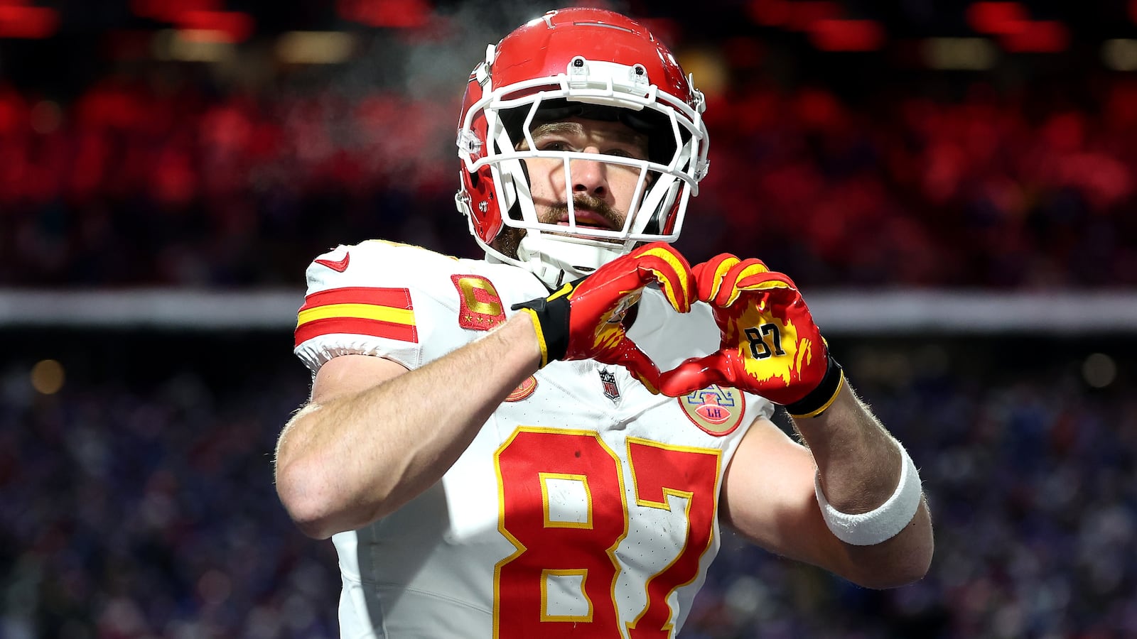 ORCHARD PARK, NEW YORK - JANUARY 21: Travis Kelce #87 of the Kansas City Chiefs celebrates after scoring a 22 yard touchdown against the Buffalo Bills during the second quarter in the AFC Divisional Playoff game at Highmark Stadium on January 21, 2024 in Orchard Park, New York.