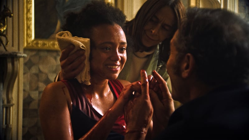 India Brown, Kate Dickie, and Jason Isaacs.