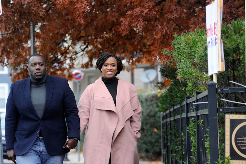 Congressional candidate Ayanna Pressley walks holding hands with her husband Conan Harris to the Adams Street Library in Boston, Massachusetts to vote on November 6, 2018. Americans started voting Tuesday in critical midterm elections that mark the first major voter test of Donald Trump's presidency, with control of Congress at stake. (Photo by Joseph PREZIOSO / AFP) (Photo by JOSEPH PREZIOSO/AFP via Getty Images)