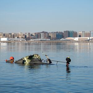 In this U.S. Coast Guard handout, the Coast Guard investigates aircraft wreckage on the Potomac River on January 30, 2025 in Washington, DC. An American Airlines flight from Wichita, Kansas collided midair with a military Black Hawk helicopter while on approach to Ronald Reagan Washington National Airport outside of Washington, DC. According to reports, there were no survivors among the 67 people onboard both aircraft.