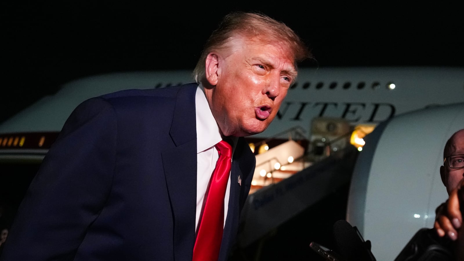U.S. President Donald Trump speaks to reporters on the tarmac before boarding Air Force One after attending the Republican Midterm Convention on September 10, 2026 at Dallas Fort Worth International Airport, Texas.