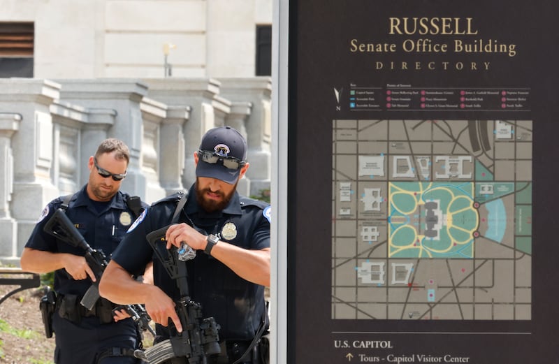 Capitol police officers stand guard outside of the Russell Senate office building.