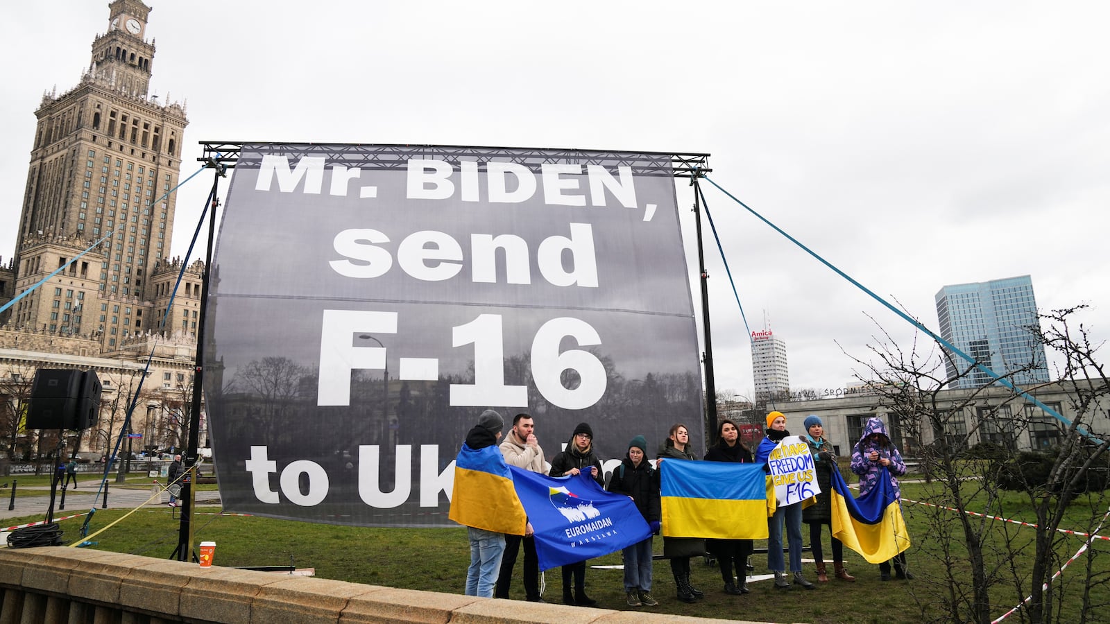 Pro-Ukraine demonstrators protest as they call on President Joe Biden to send F-16 jets to Ukraine, in Warsaw, Poland, Feb. 22, 2023.