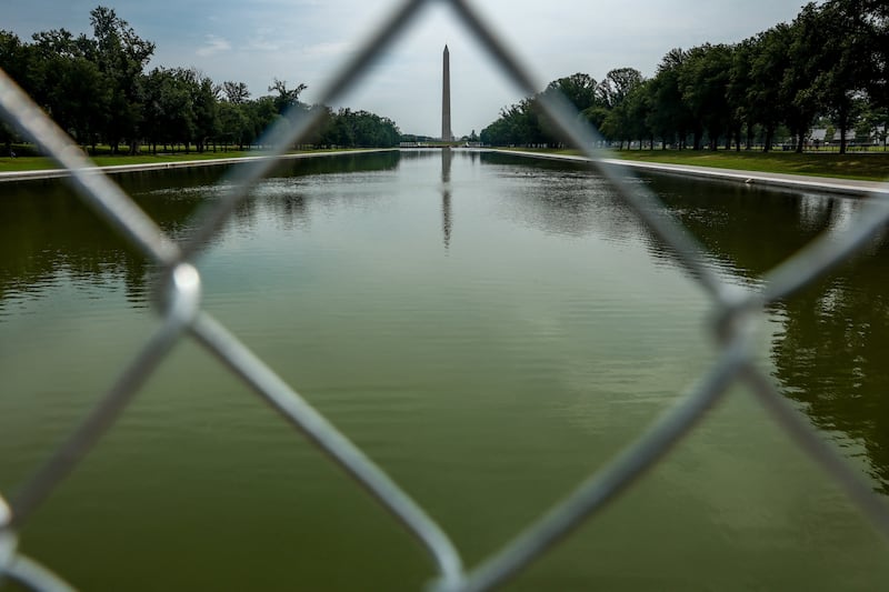 The Reflecting Pool which is encircled by fencing in Washington, D.C., U.S., July 10, 2026.  REUTERS/Evelyn Hockstein