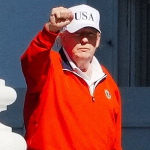 President Donald Trump raises his fist as he returns to the White House from his golf club on May 31, 2026, just hours before raging about coverage of the Iran talks in a post.