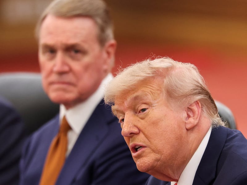 U.S. President Donald Trump, seated next to U.S. Ambassador to China David Perdue, at a bilateral meeting with Chinese President Xi Jinping in Beijing, China May 14, 2026