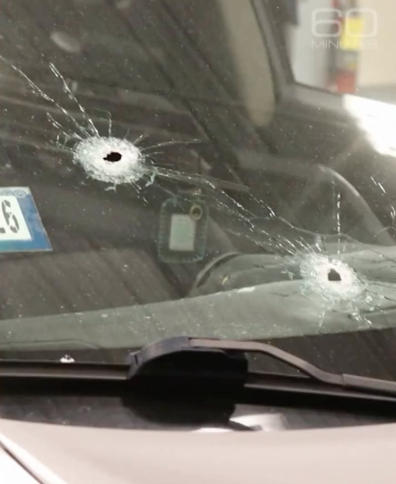 Two of the bullet holes in the windshield of Marimar Martinez's car.