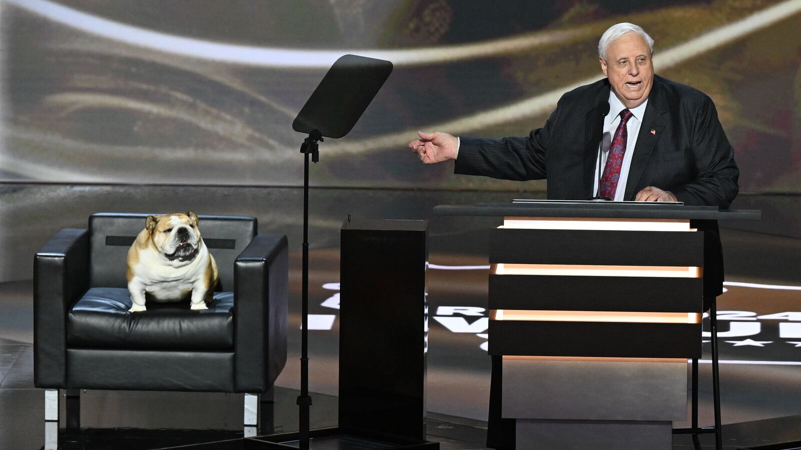West Virginia Gov. Jim Justice and his dog, Babydog, on stage during the Republican National Convention in Milwaukee, Wisconsin in July.