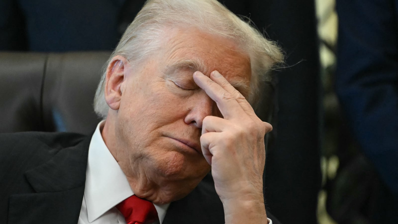 Donald Trump with his eyes closed in the Oval Office of the White House in Washington, DC on November 6, 2025.