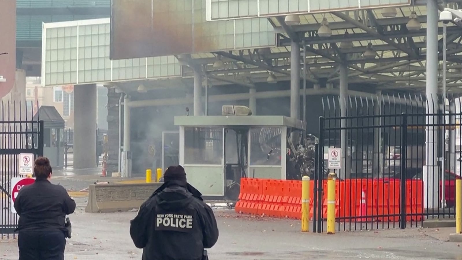 Police officers view the scene after an incident at the Rainbow Bridge U.S. border crossing with Canada, in Niagara Falls.