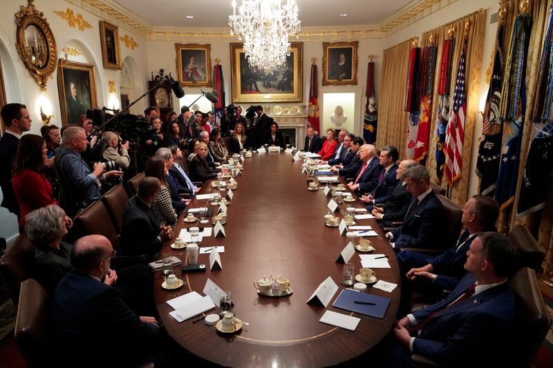 President Donald Trump holds a meeting of his Cabinet in the Cabinet Room of the White House on December 2 where members of his team went around the room singing his praises.