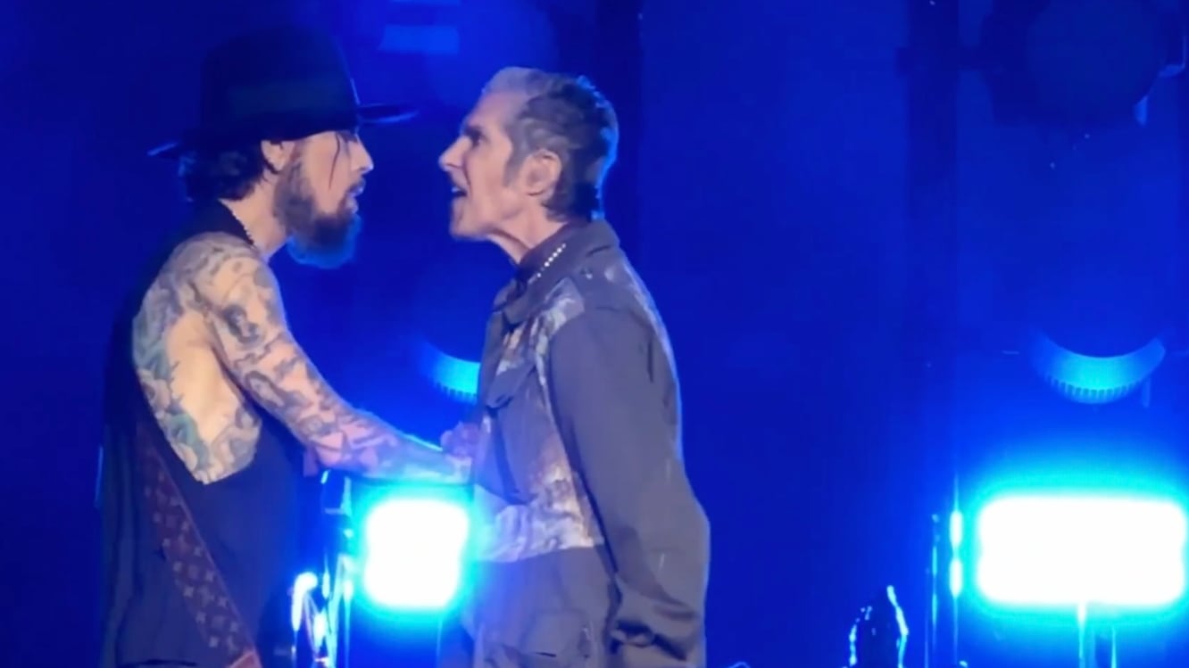Jane’s Addiction frontman Perry Farrell punches guitarist Dave Navarro at their Boston concert.